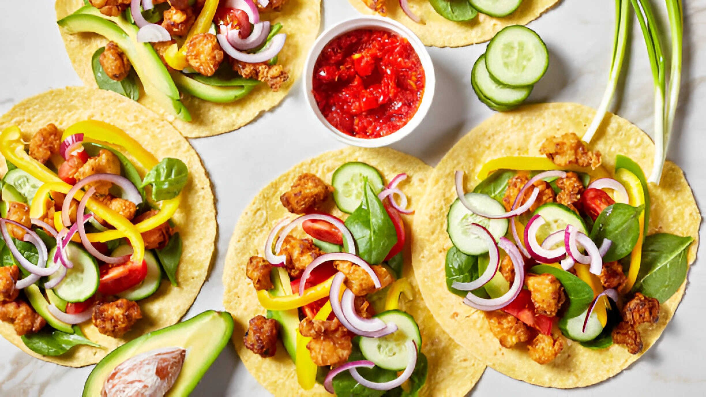 Freshly made chicken taquitos cooking in hot oil until golden brown